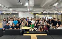 Team celebrating a company anniversary at the office