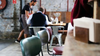 Empty tables and chairs to portray the business struggle of a business owner